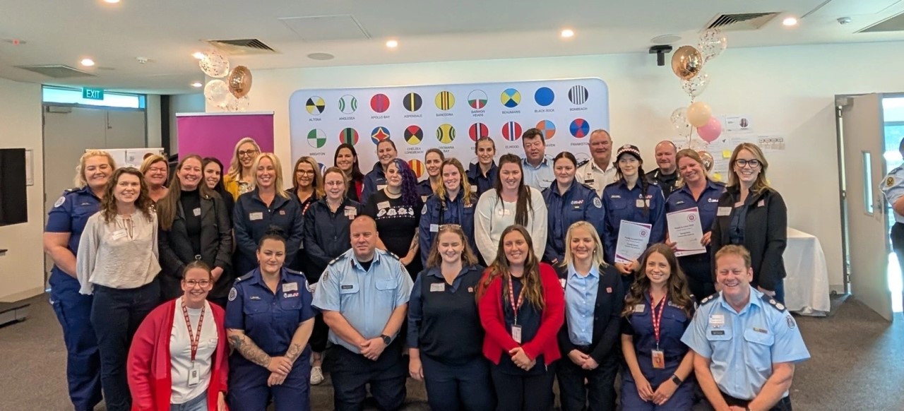 CFA graduates with their sponsors and senior leaders
